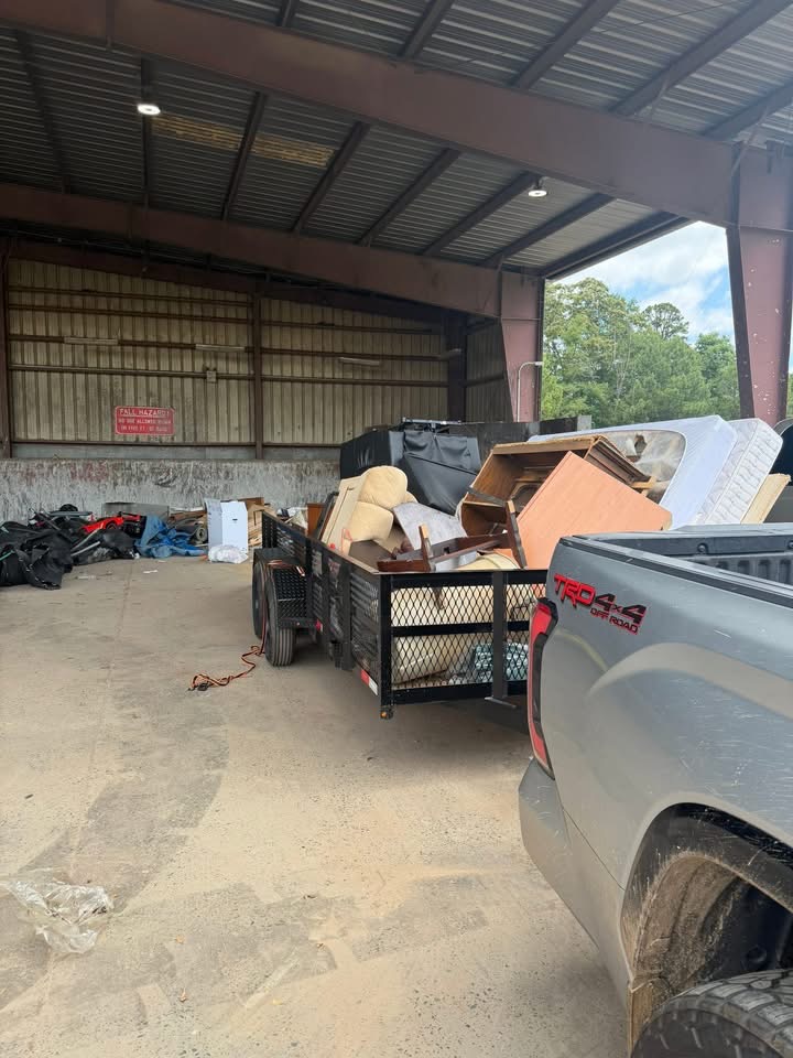 Bulky furniture, mattress and household items loaded for disposal